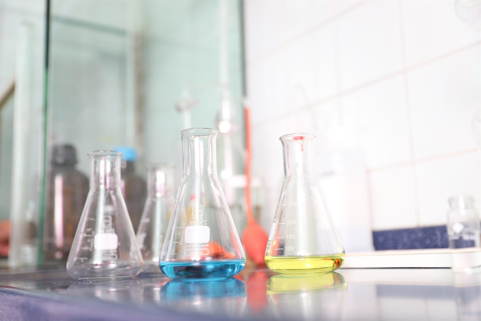 Conical flasks holding prepared test solutions